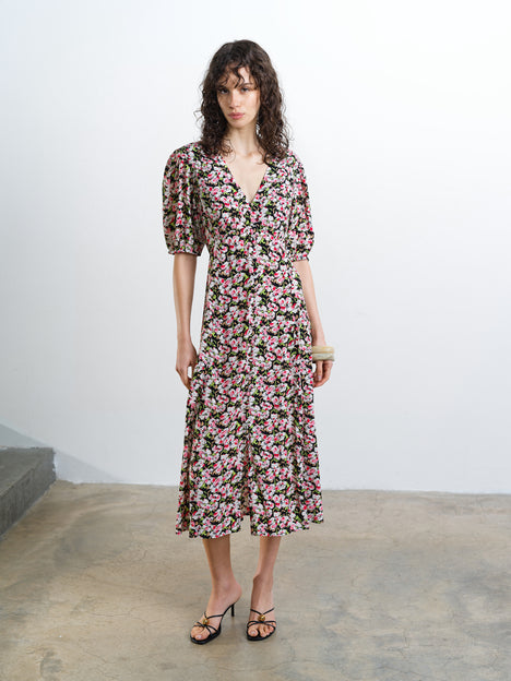 Woman wearing a V-neck floral midi dress 