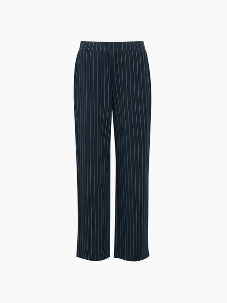 A woman wearing pinstripe navy blue pull-on trousers with an elasticated waist, side pockets and a wide leg full length fit.